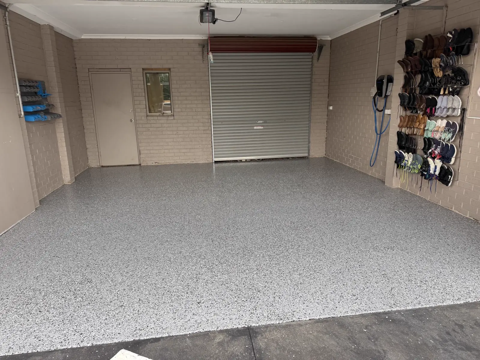 Flake epoxy garage floor coating with freshly painted walls in Melbourne