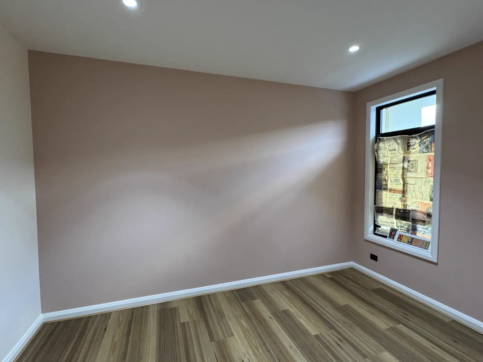 Freshly repainted bedroom with warm neutral walls and white ceiling in Melbourne