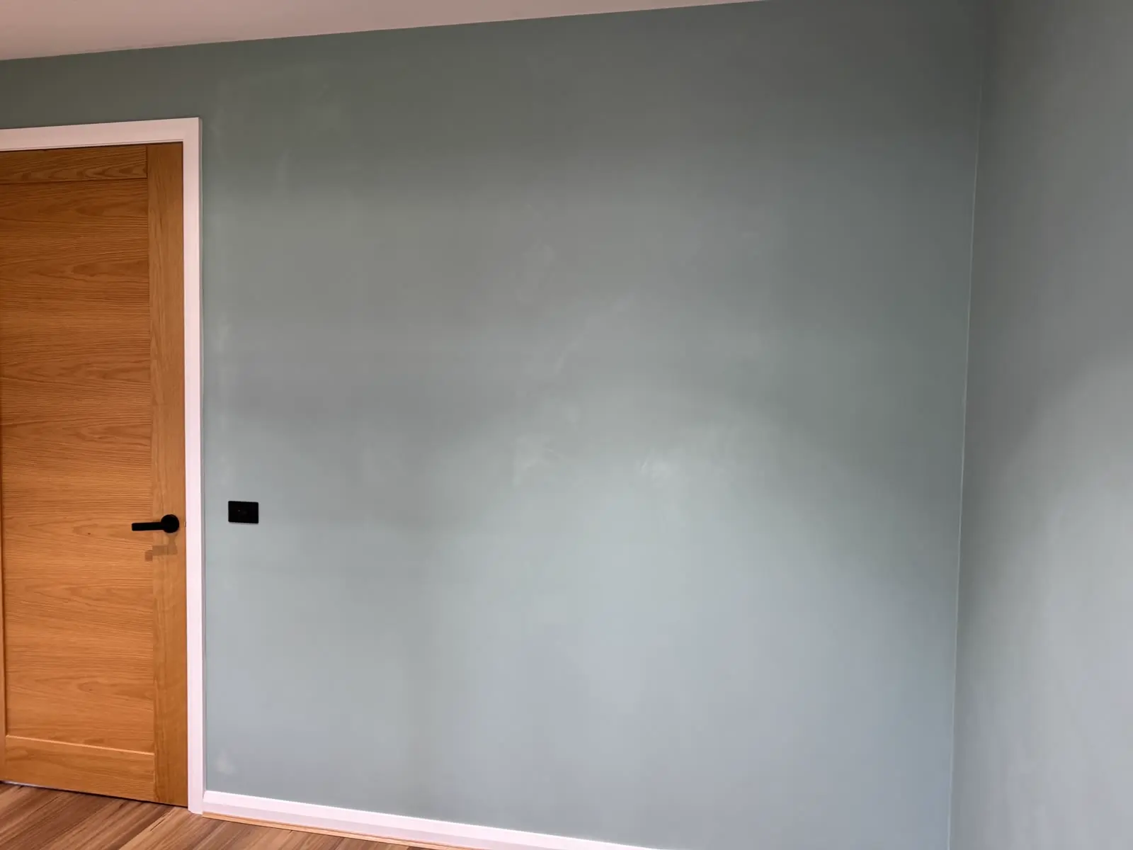 Smooth grey interior walls and crisp white trims painted by Freshy Painting